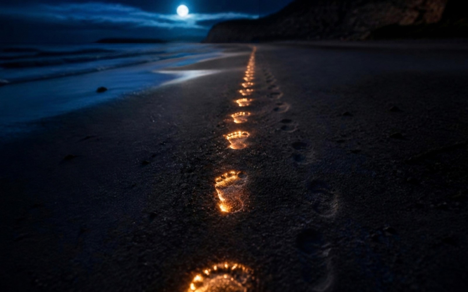 A trail of glowing amber footprints leading down a moonlit beach toward the water, a full moon reflected in the distance