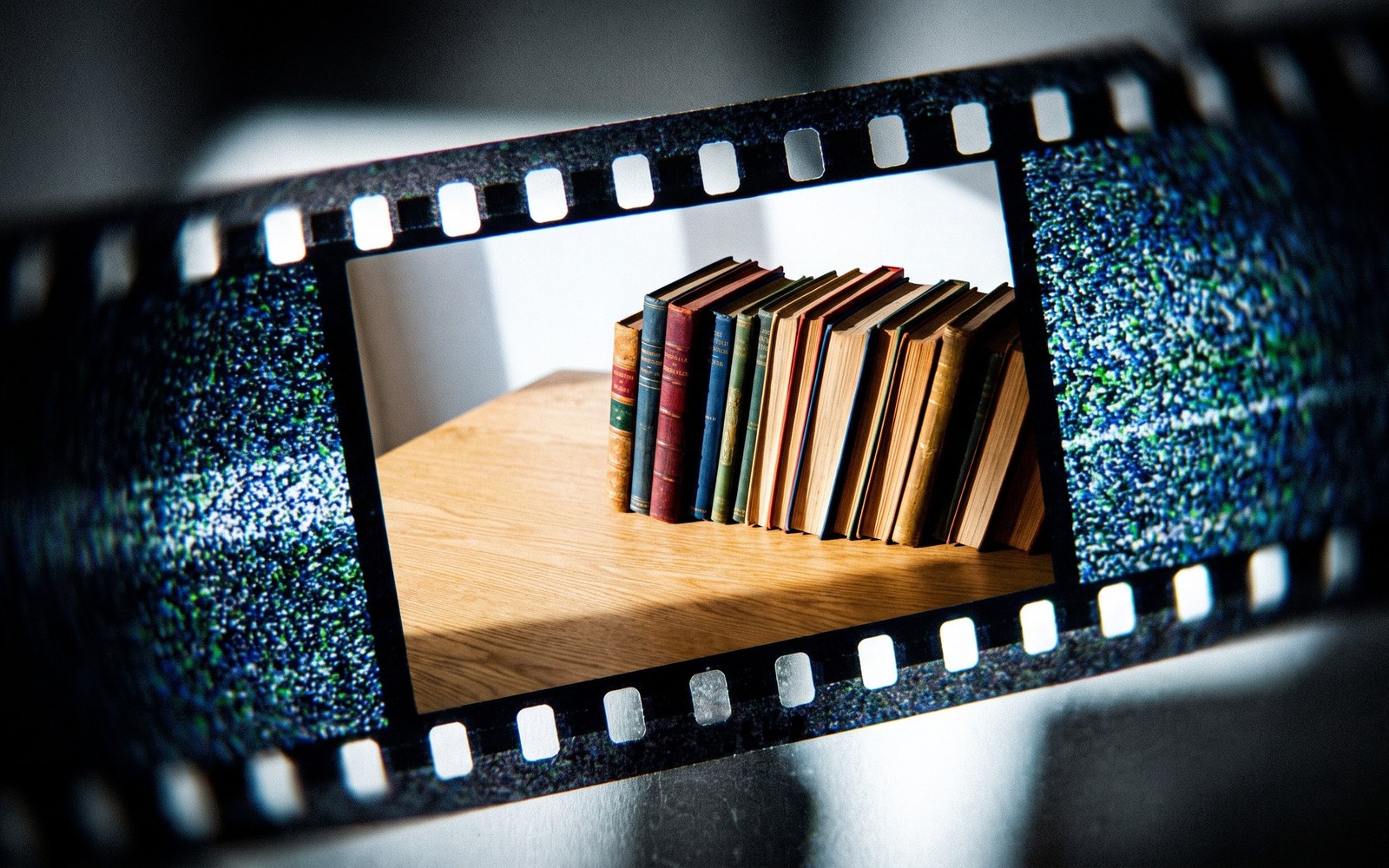 A sharply detailed, brightly lit film frame that dissolves into blur and static at its edges