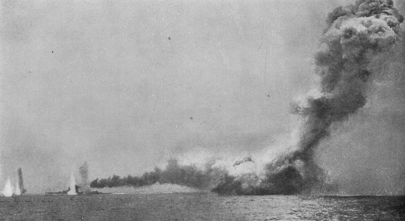 HMS Lion under fire beside HMS Queen Mary's magazine exploding, photographed from HMS Lydiard during the Battle of Jutland, May 31, 1916.
