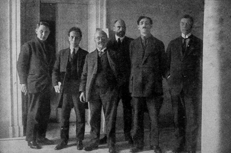 Foreign reporters covering the German National Assembly at Weimar, February 1919, seated at desks in the press gallery.