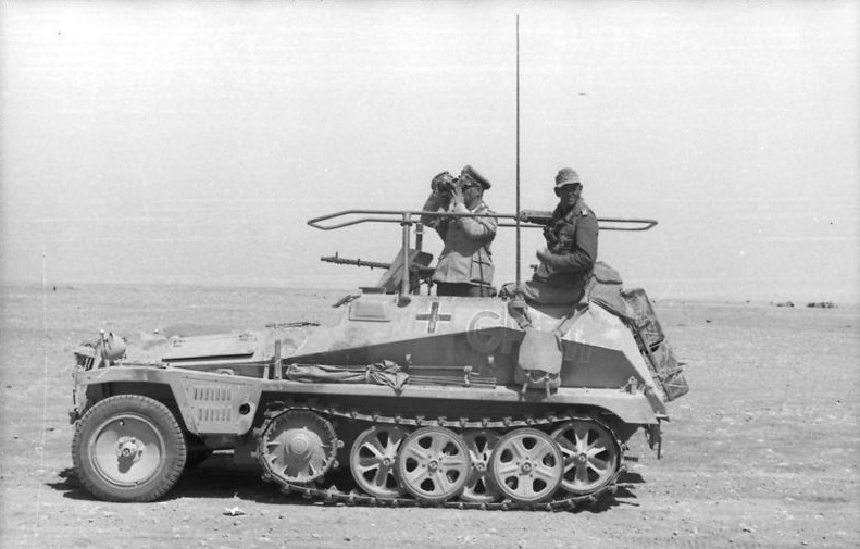 German generals Erwin Rommel and Fritz Bayerlein in their command vehicle, an armored half-track nicknamed 'Greif,' North Africa, June 1942.