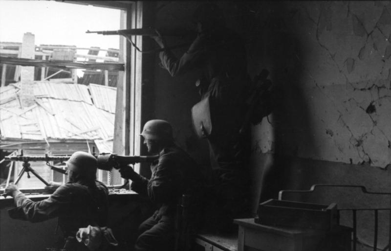 German soldiers in close-quarters house-to-house fighting inside Stalingrad, 1942.