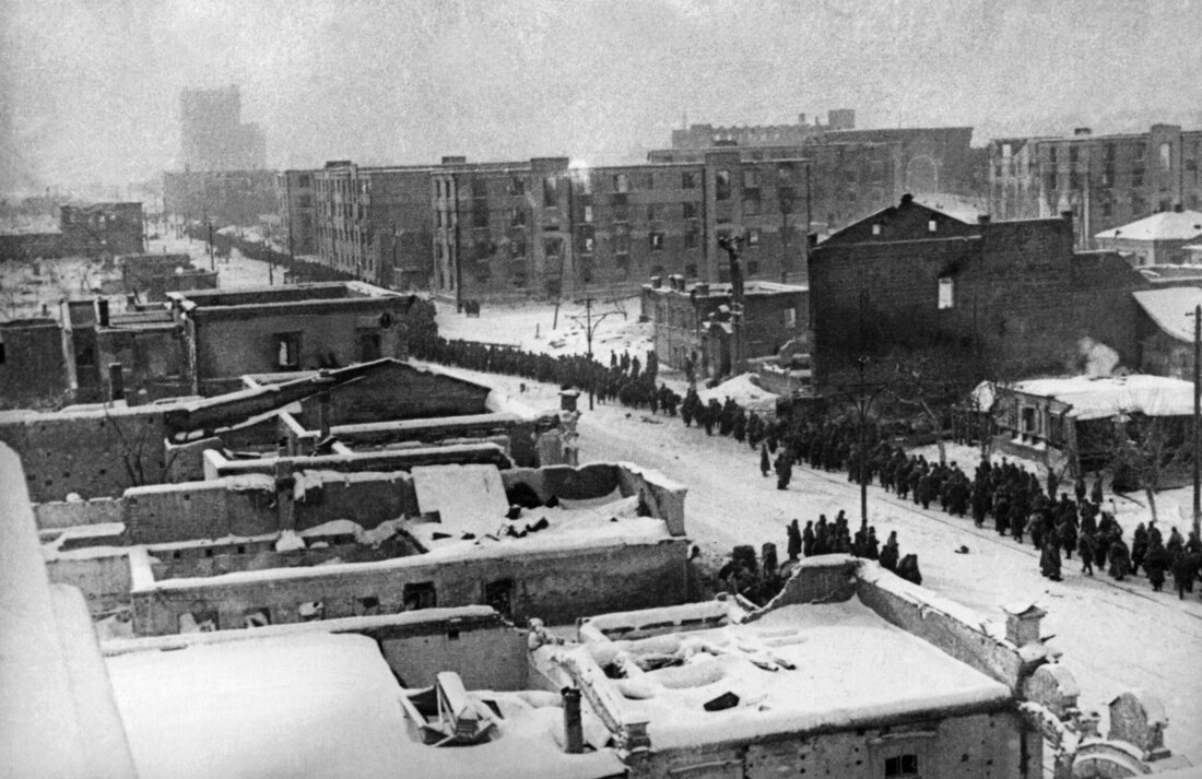 A column of German prisoners of war marching down a street in Stalingrad after the surrender, February 1943.