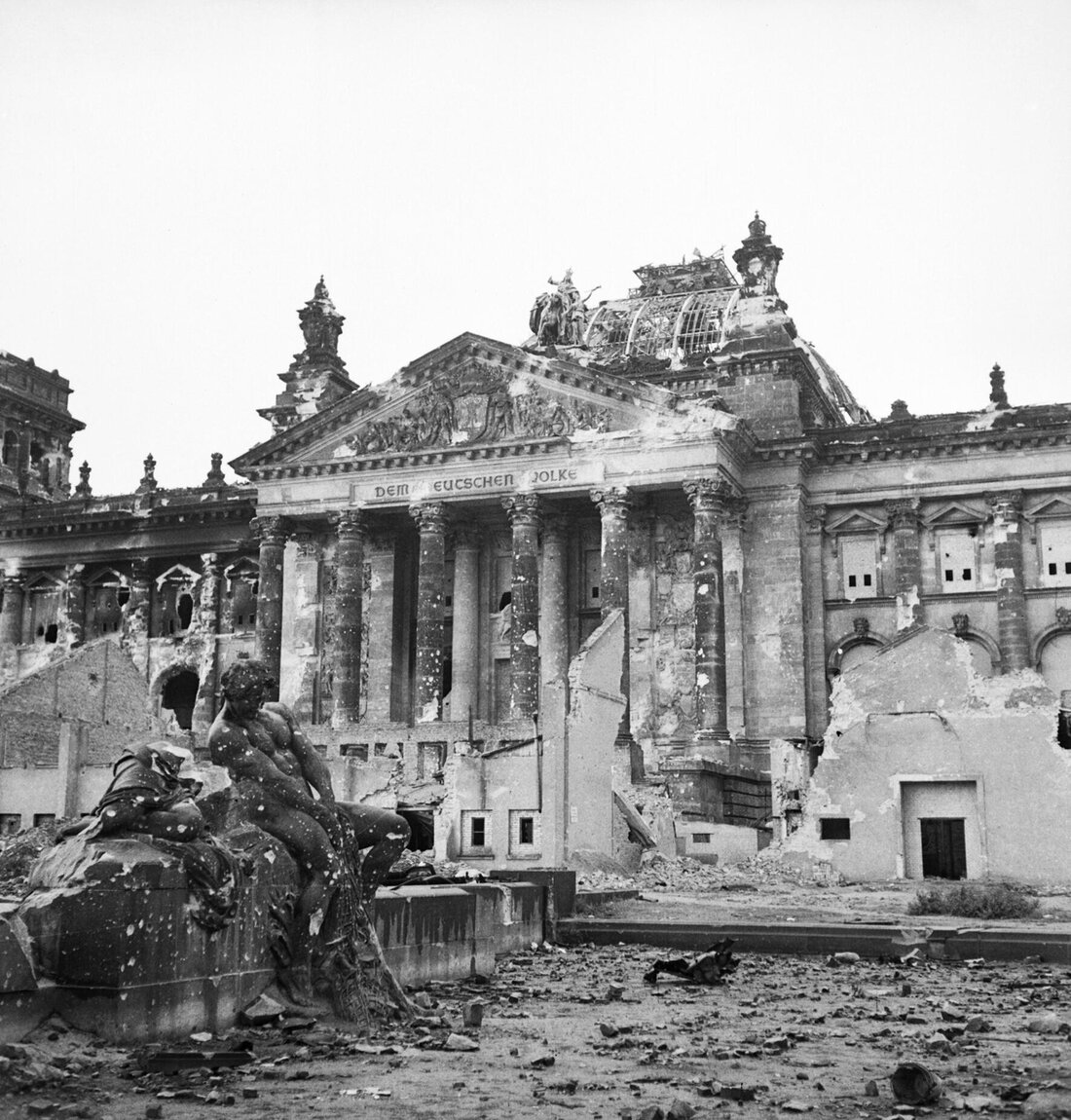 The Reichstag, dome collapsed and colonnade shell-pocked, June 1945.