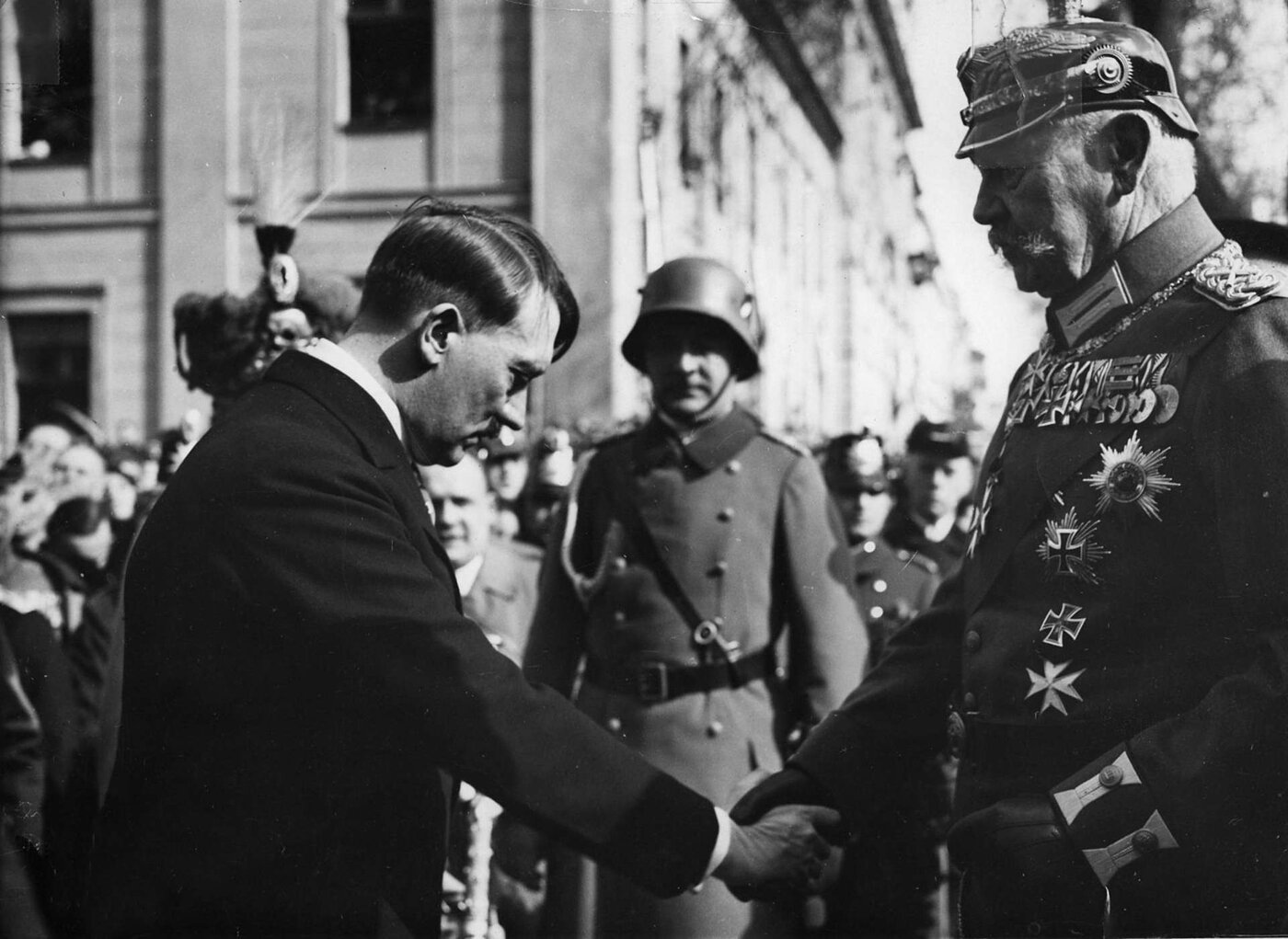 Reich President Paul von Hindenburg shaking hands with Reich Chancellor Adolf Hitler outside the Garrison Church, Potsdam, March 21, 1933.