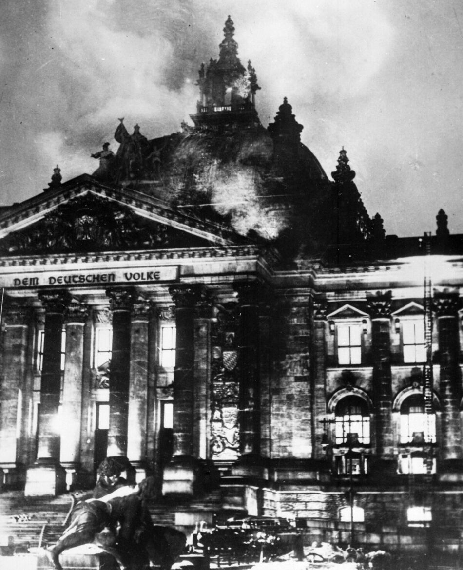 Firemen working on the burning Reichstag building, Berlin, night of February 27, 1933.