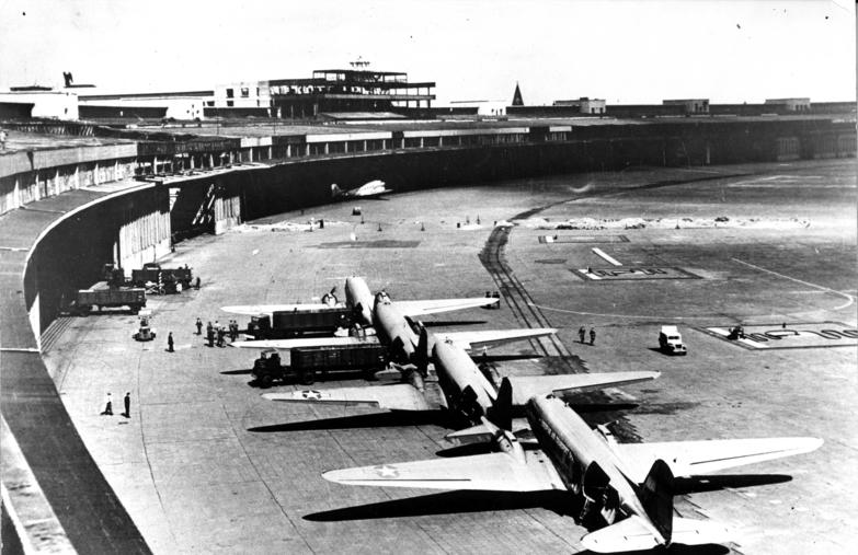 C-47 Skytrain transport aircraft parked in front of the terminal building at Tempelhof Central Airport during the Berlin Airlift, August 1948.