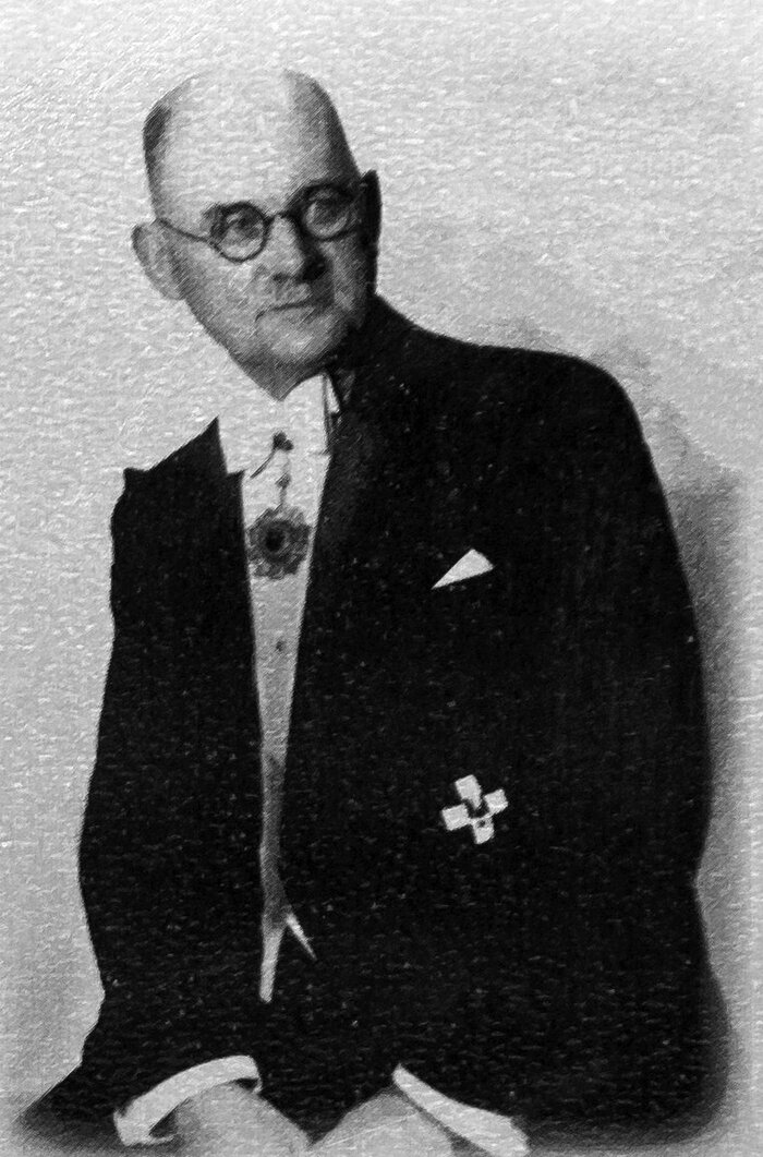 A black-and-white portrait photograph of John Rabe, the German Siemens representative and Nazi Party member who chaired the committee running the Nanjing Safety Zone.