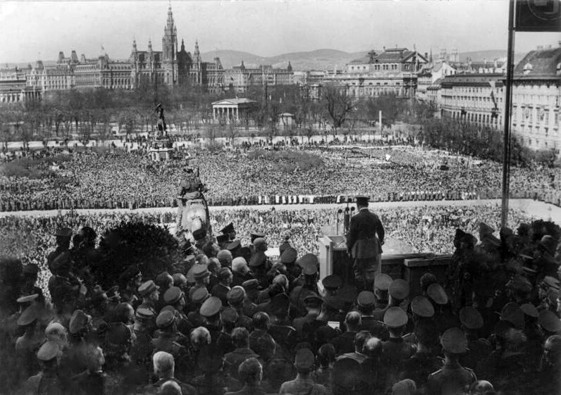Adolf Hitler addressing the crowd from the balcony of the Hofburg on Heldenplatz, Vienna, March 15, 1938.