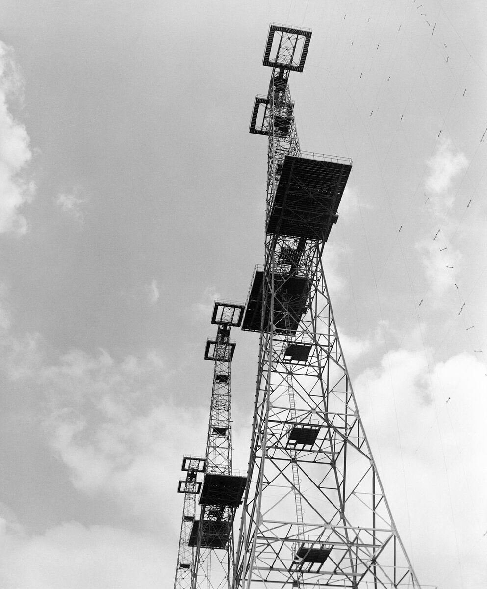 The 360-foot transmitter towers at the Bawdsey Chain Home radar station, Suffolk, photographed in 1945 — the same masts that had been operational since before the Battle of Britain.